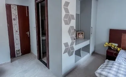 Room entrance with a wardrobe and study shelf