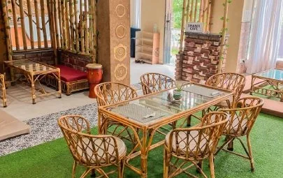 Cane dining sets beside a bamboo screen and a drum