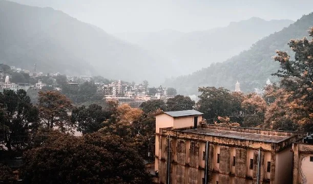 Misty valley of Rishikesh seen from a rooftop