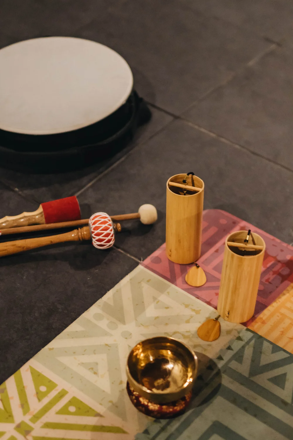 Sound healing instruments: a drum, mallets, koshi chimes and a singing bowl