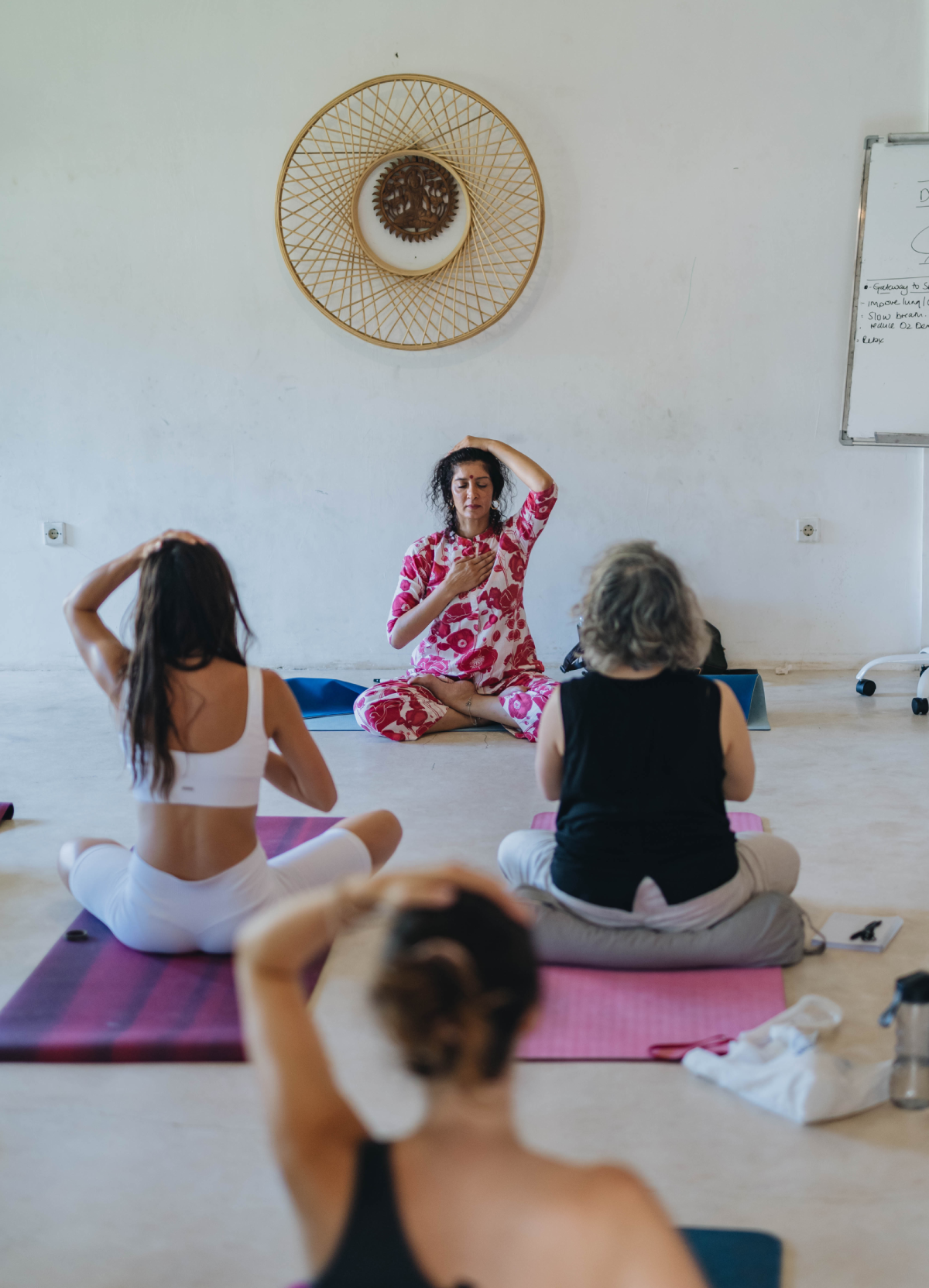 Maa Haripriya leading students through a seated kundalini practice