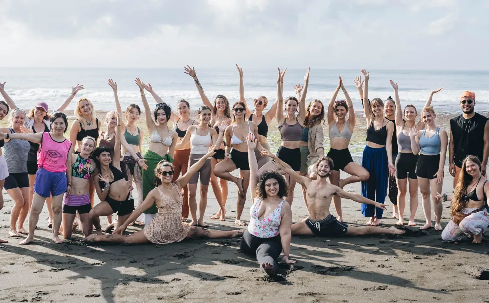 A group of students celebrating on a Bali beach
