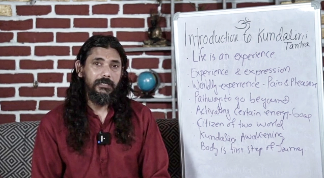 Yogi Vishnu teaching an introduction to Kundalini Tantra on a whiteboard
