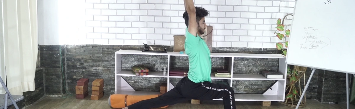 A student in a high lunge with arms raised