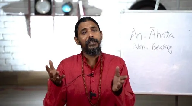 Yogi Vishnu explaining the Anahata chakra at a whiteboard