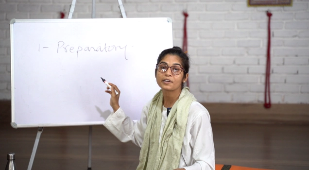 A World Peace Yoga School teacher leading a theory class
