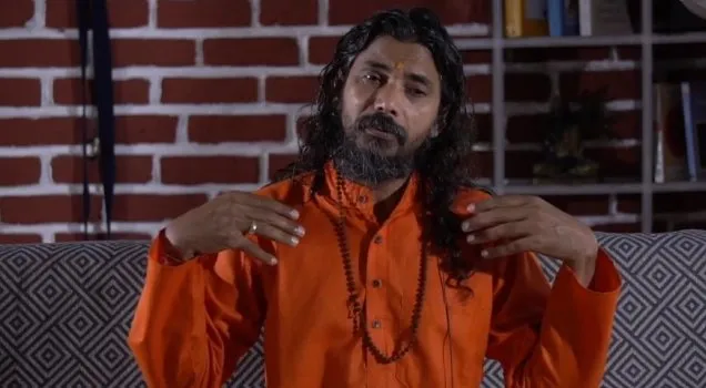A teacher explaining yoga philosophy in an online lecture