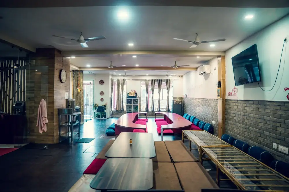 Dining hall with low tables and floor cushions