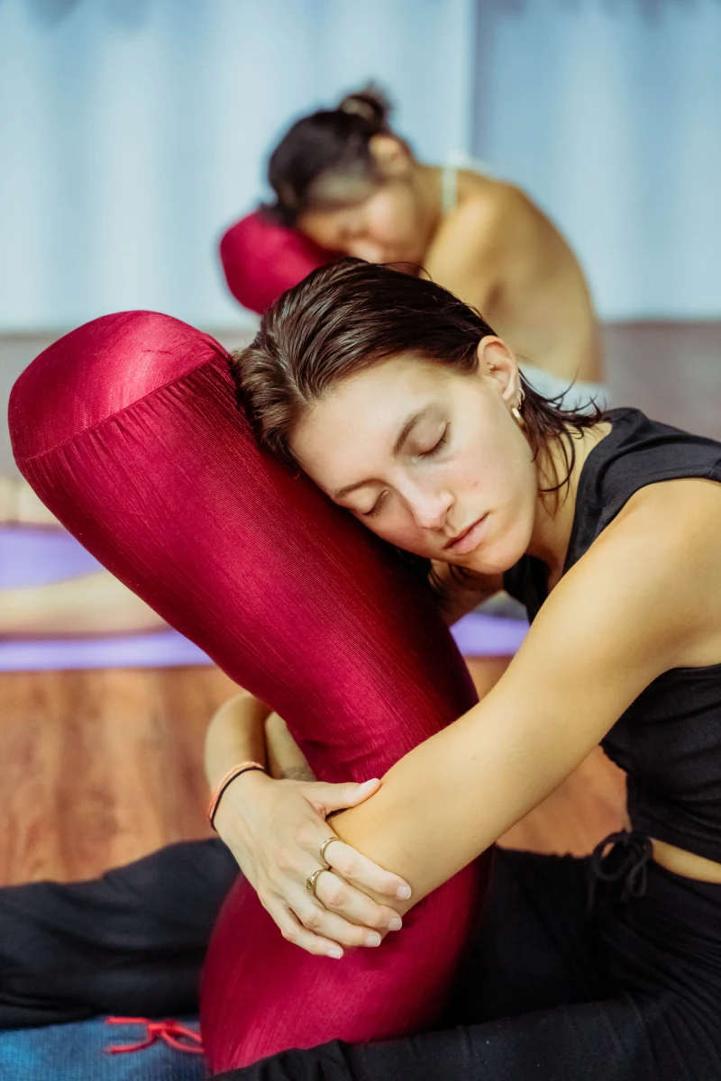 A student holding a long Yin Yoga posture