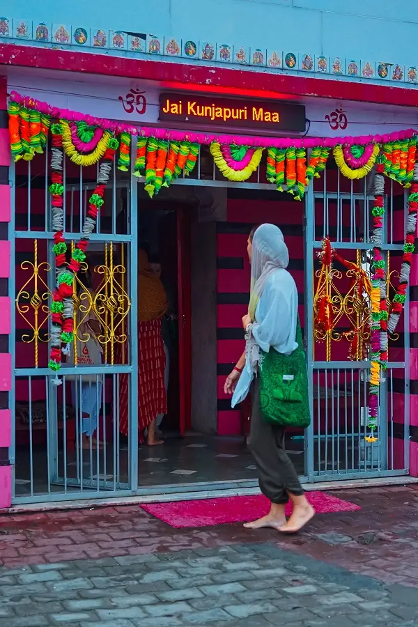 The entrance of Kunjapuri Temple, hung with marigold garlands