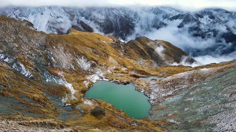 A sacred turquoise lake cradled by high mountains