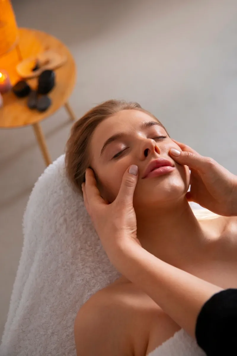 A woman receiving a gentle face massage