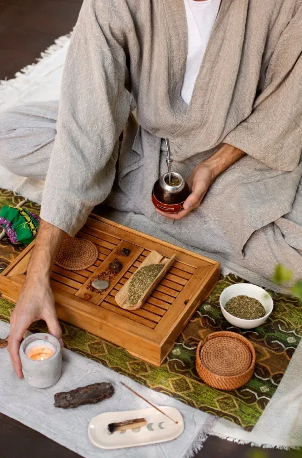 Herbs and a tea tray laid out for an Ayurvedic ritual