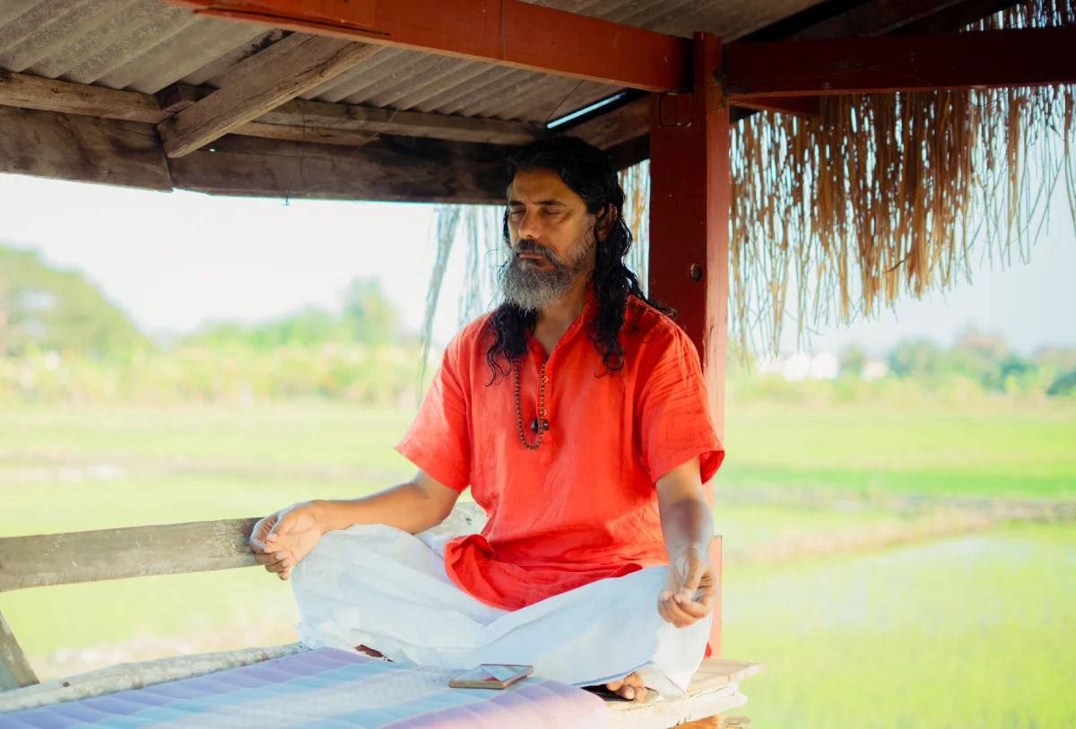 A student in a seated kundalini practice at World Peace Yoga School Thailand