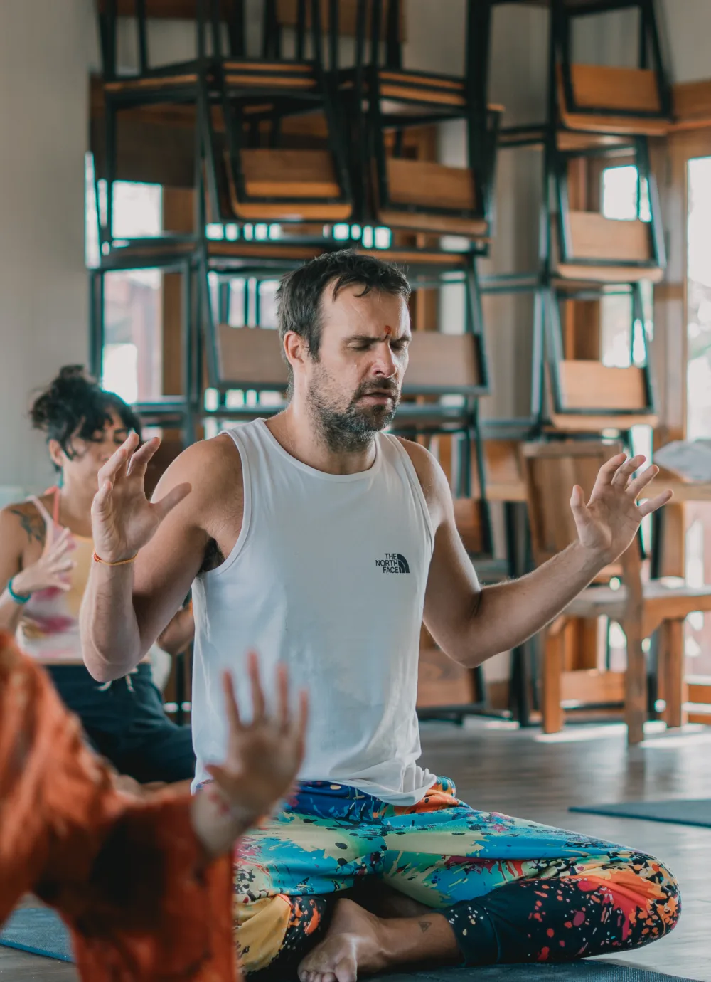 A resident in breathwork practice in the yoga hall