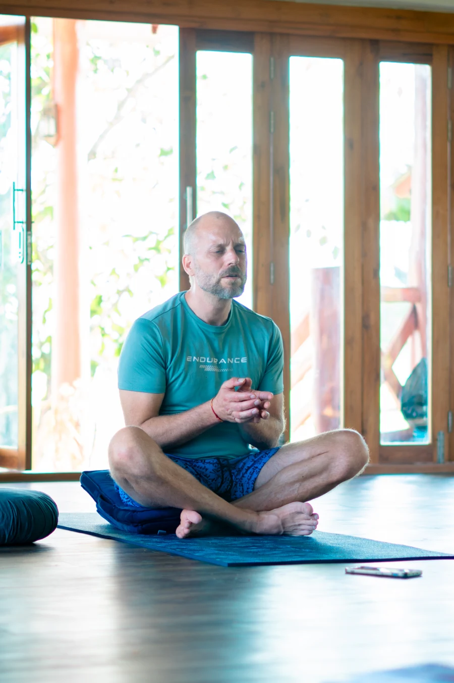 A guest seated in breathwork practice