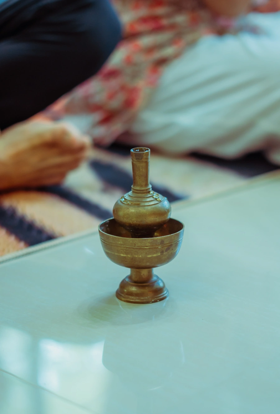 A small brass ritual vessel on a table