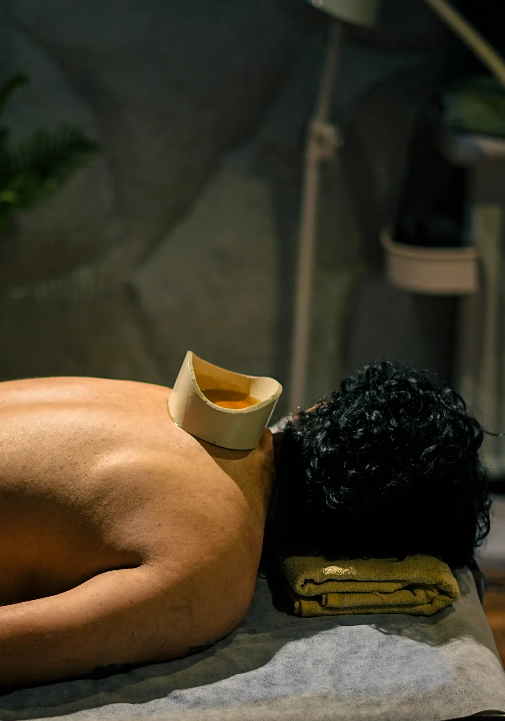 Greeva Basti warm oil therapy on the upper back