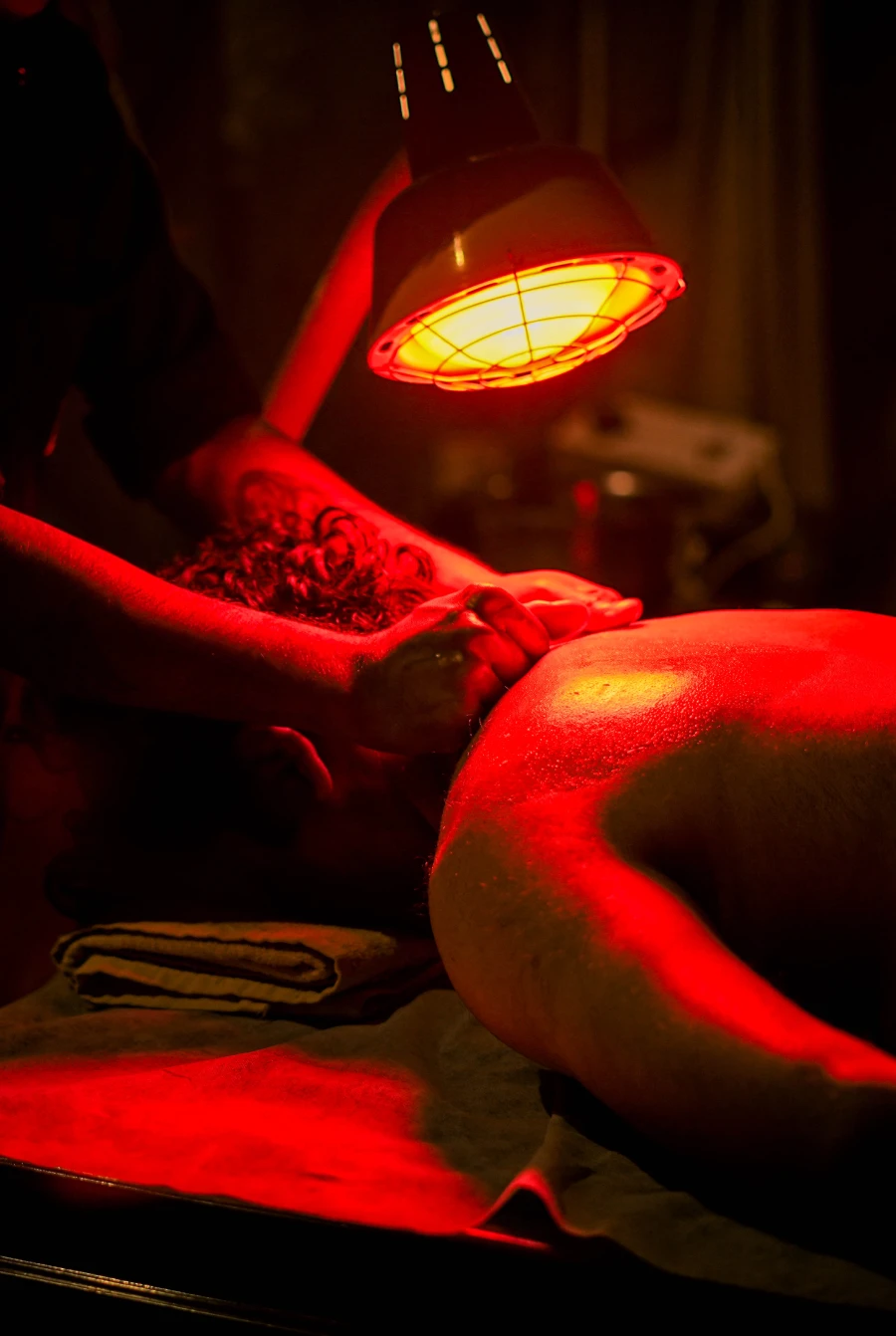 Massage under a warm heat lamp