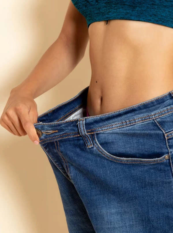 Loose jeans showing weight loss results